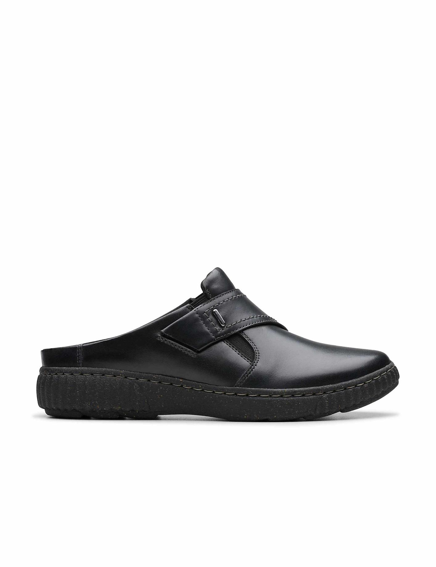 A black leather slip-on shoe sits in the foreground against a plain white background. Product Image 1
