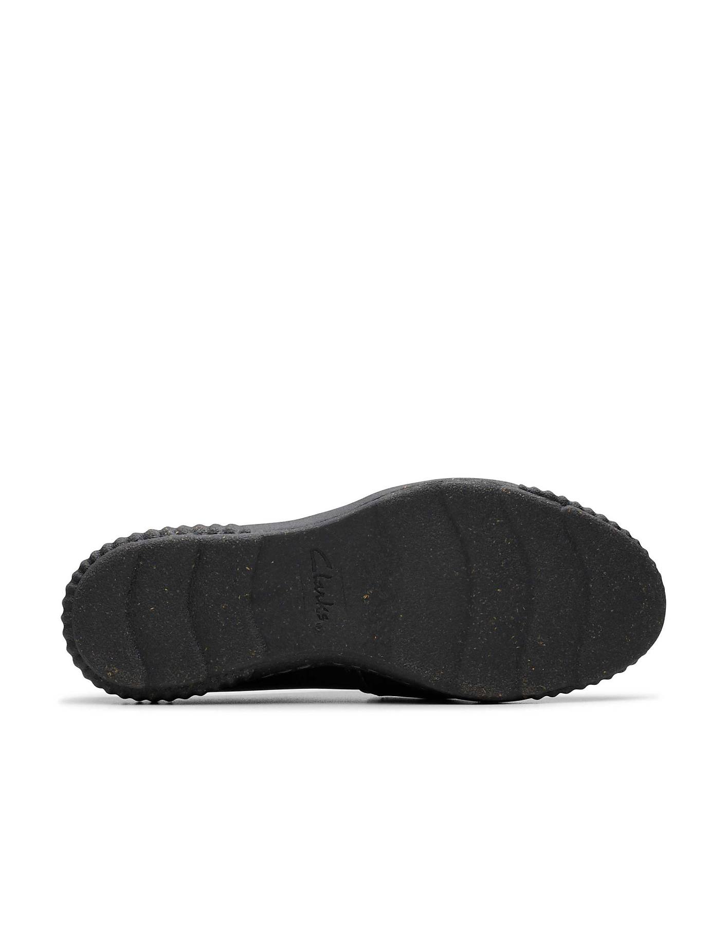 A black shoe sole with the "Clarks" logo is centered against a plain white background. Product Image 4
