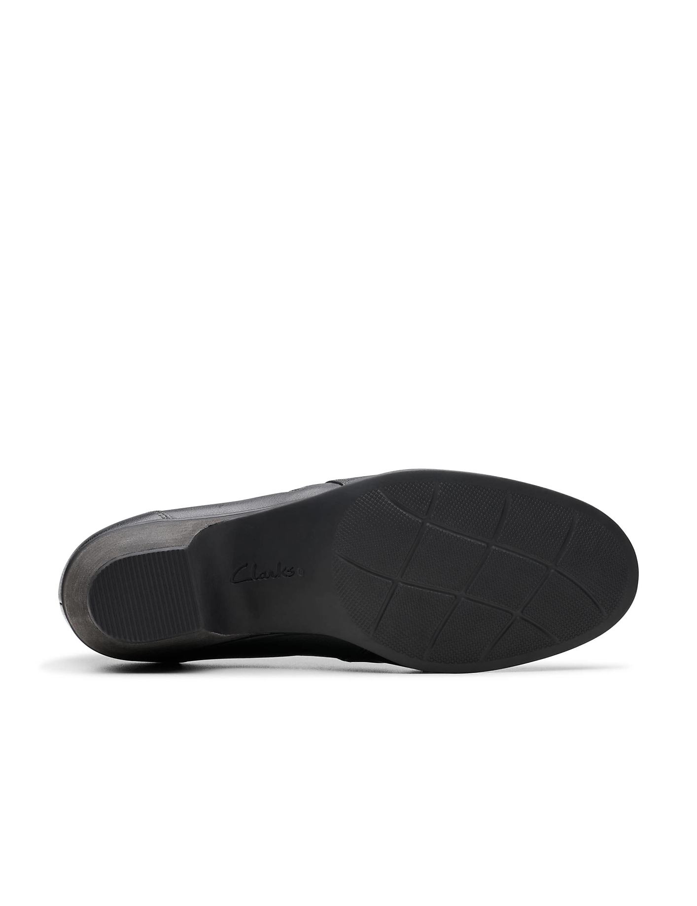 A black Clarks shoe is positioned horizontally in the foreground against a plain white background. Product Image 4