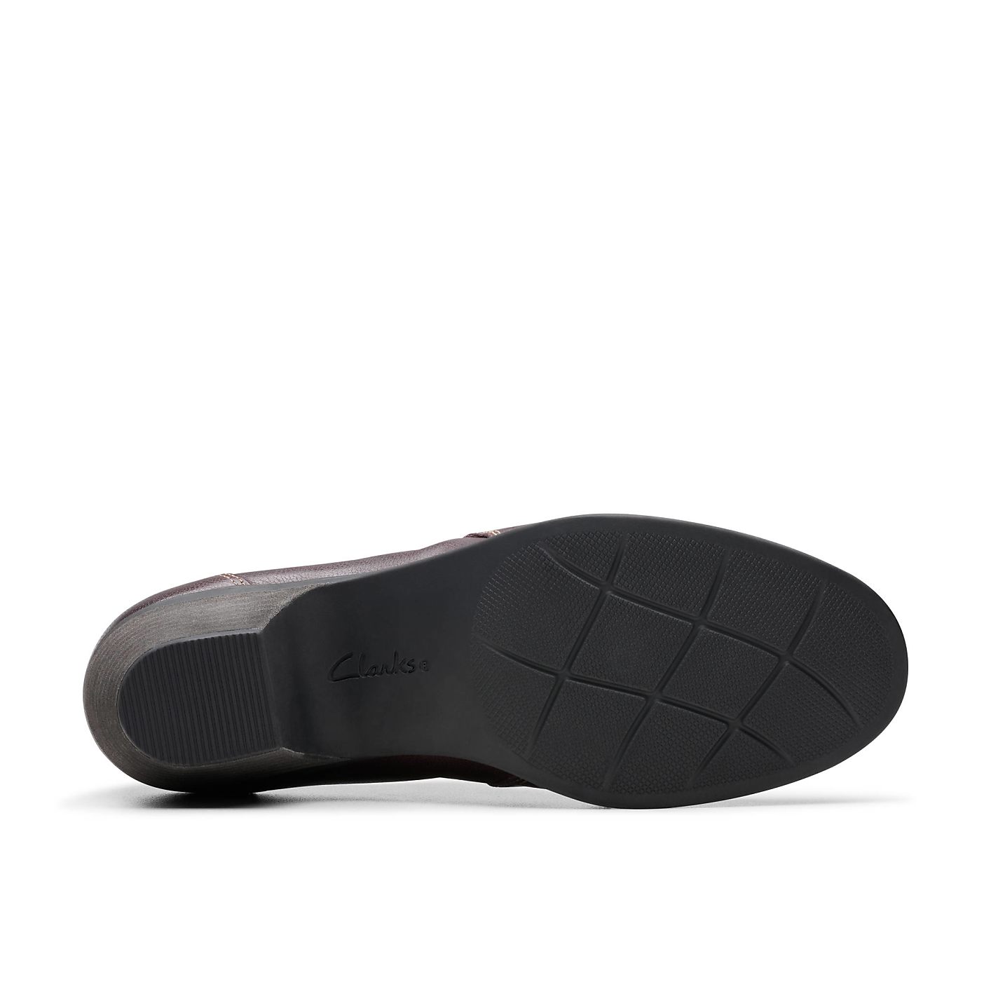 A brown leather shoe with a black sole is positioned in the foreground against a plain white background. Product Image 4