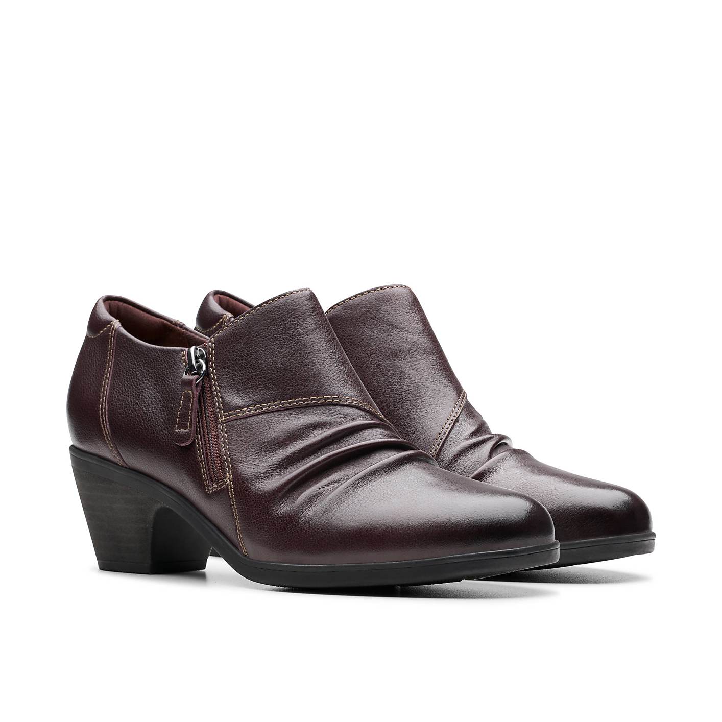 A pair of dark burgundy leather ankle boots with zippers sits against a plain white background. Product Image 5