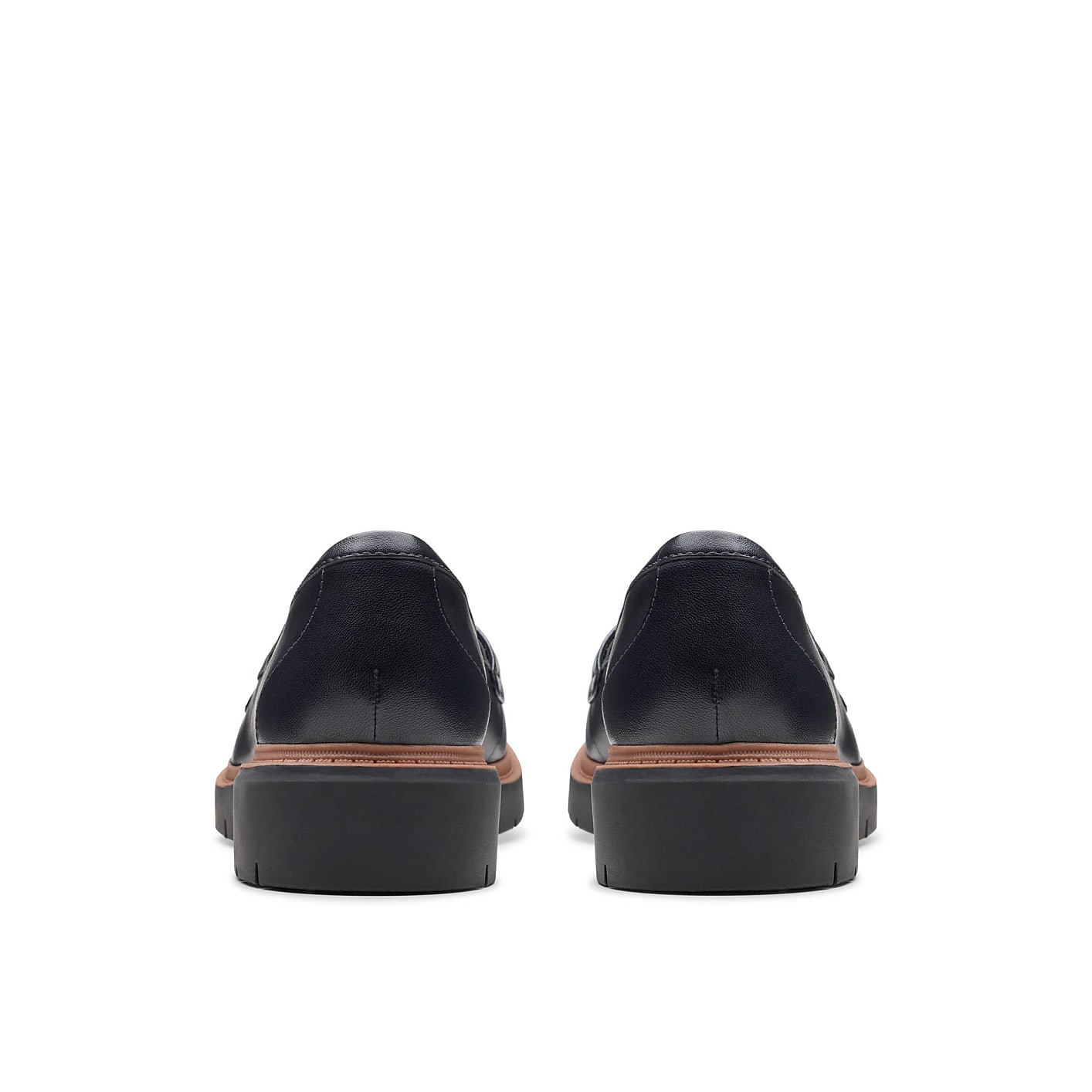 A pair of dark navy leather loafers are positioned in the foreground against a plain white background. Product Image 2