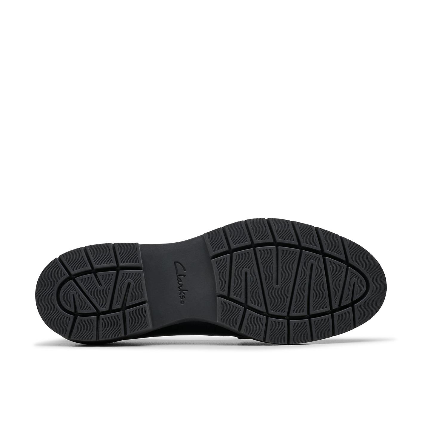 A black textured shoe sole with the "Clarks" logo is centered against a plain white background. Product Image 4