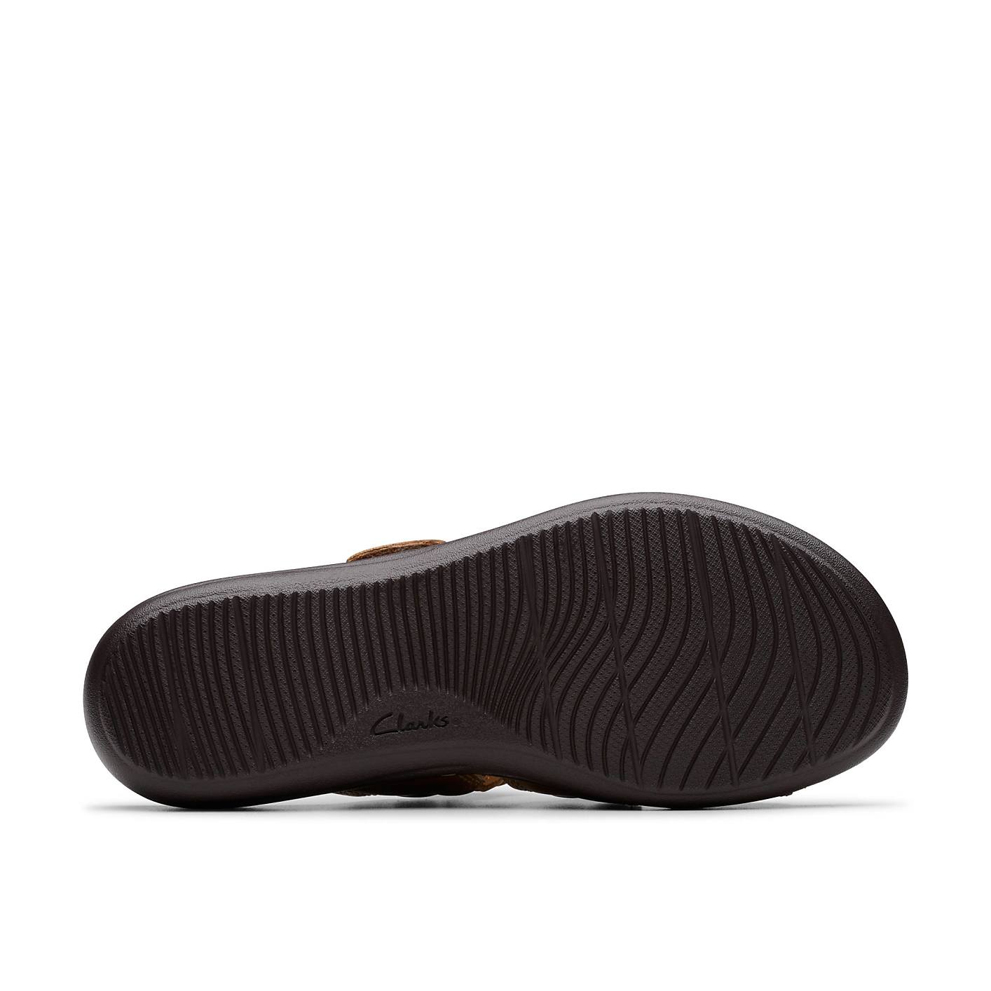 A brown textured shoe sole sits in the foreground against a plain white background. Product Image 4