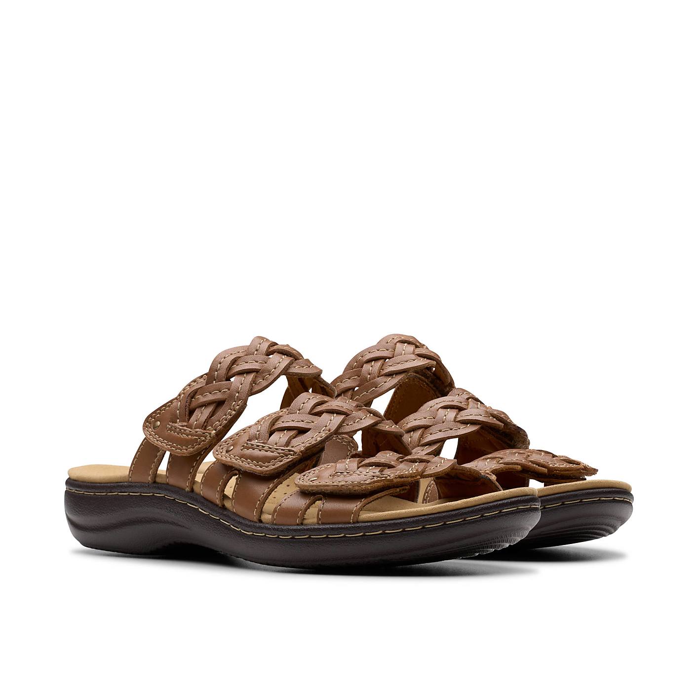 A pair of brown braided leather sandals sits against a plain white background. Product Image 5