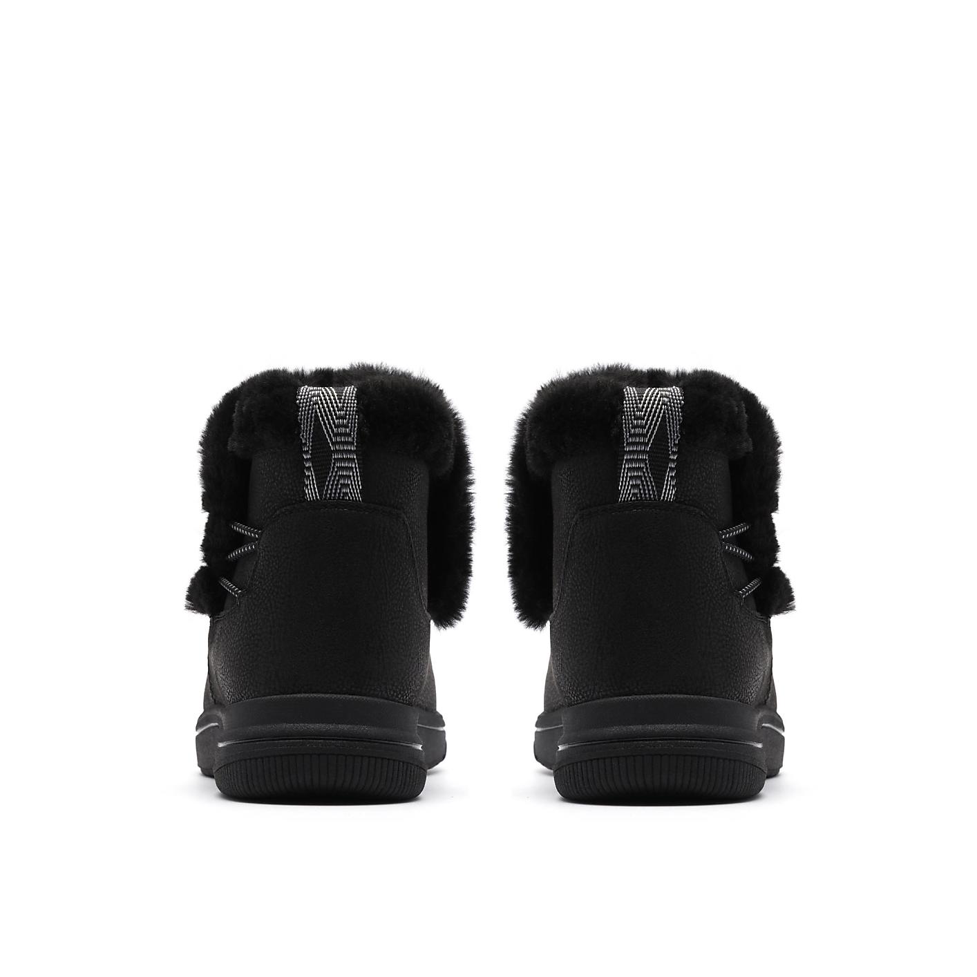 A pair of black faux-fur lined boots are positioned side-by-side against a plain white background. Product Image 2
