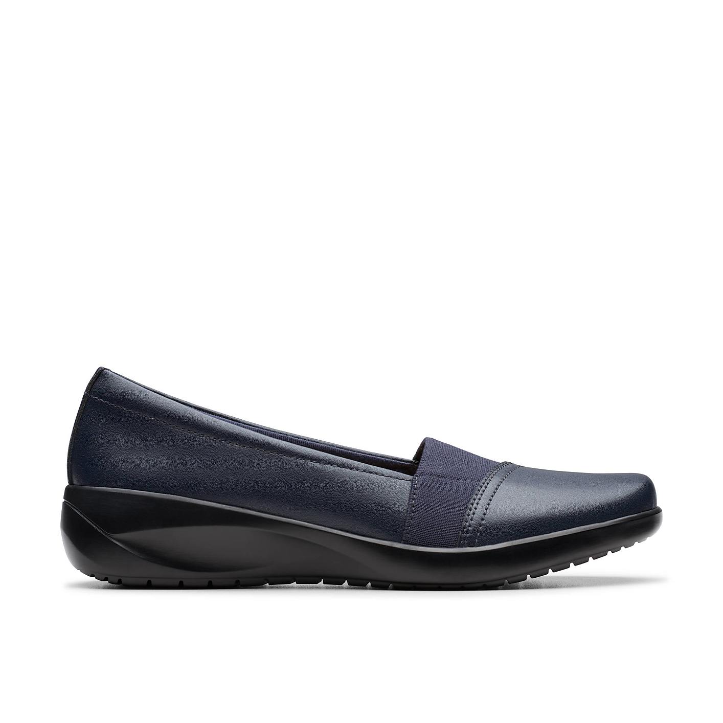 A navy blue slip-on shoe sits in the foreground against a plain white background. Product Image 1