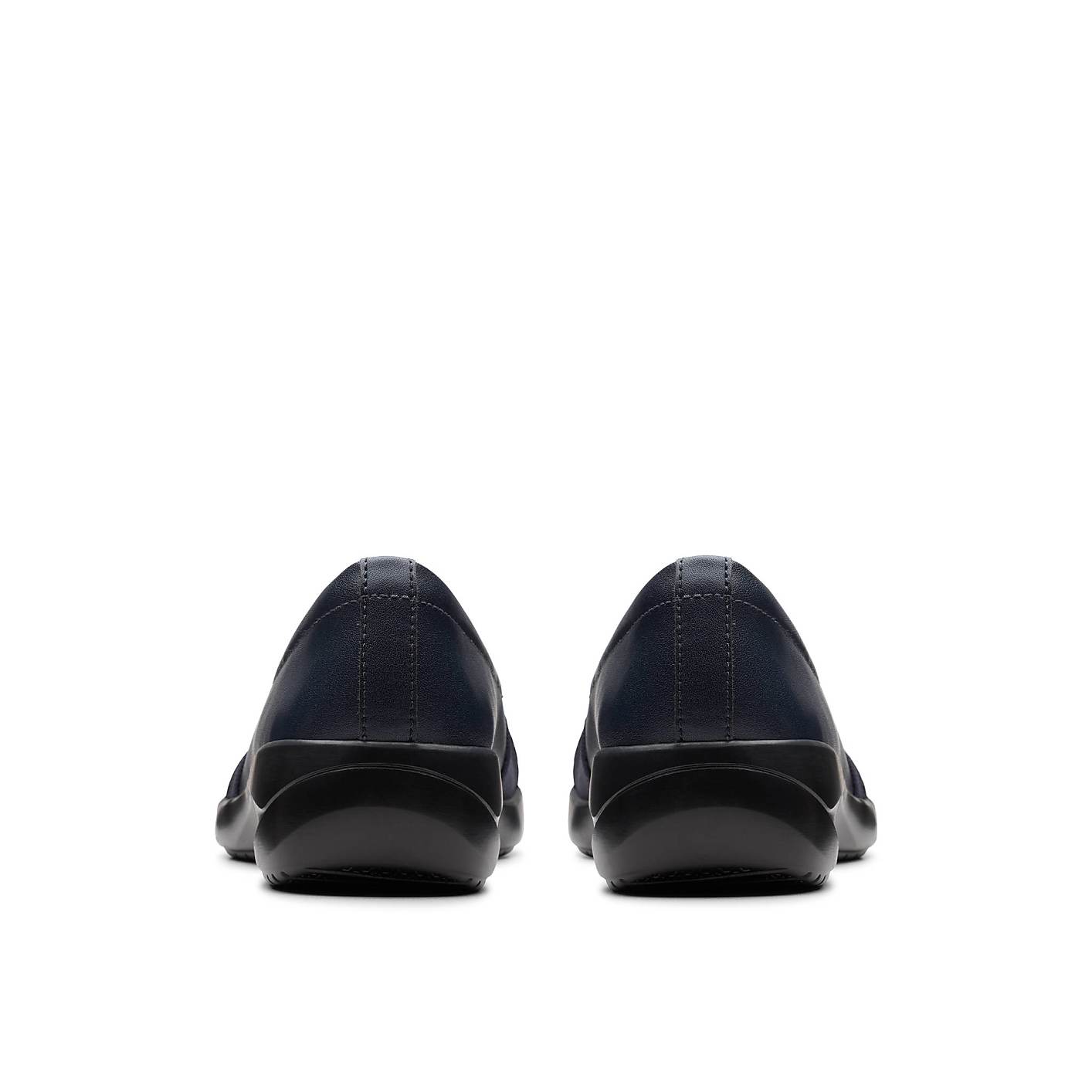 A pair of navy blue slip-on shoes are positioned in the foreground against a plain white background. Product Image 2