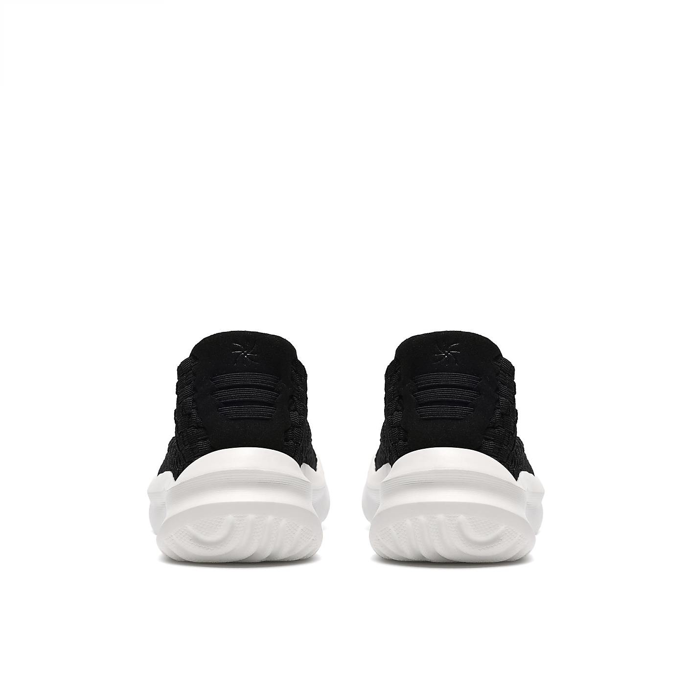 A pair of black sneakers with white soles are positioned side-by-side against a plain white background. Product Image 2