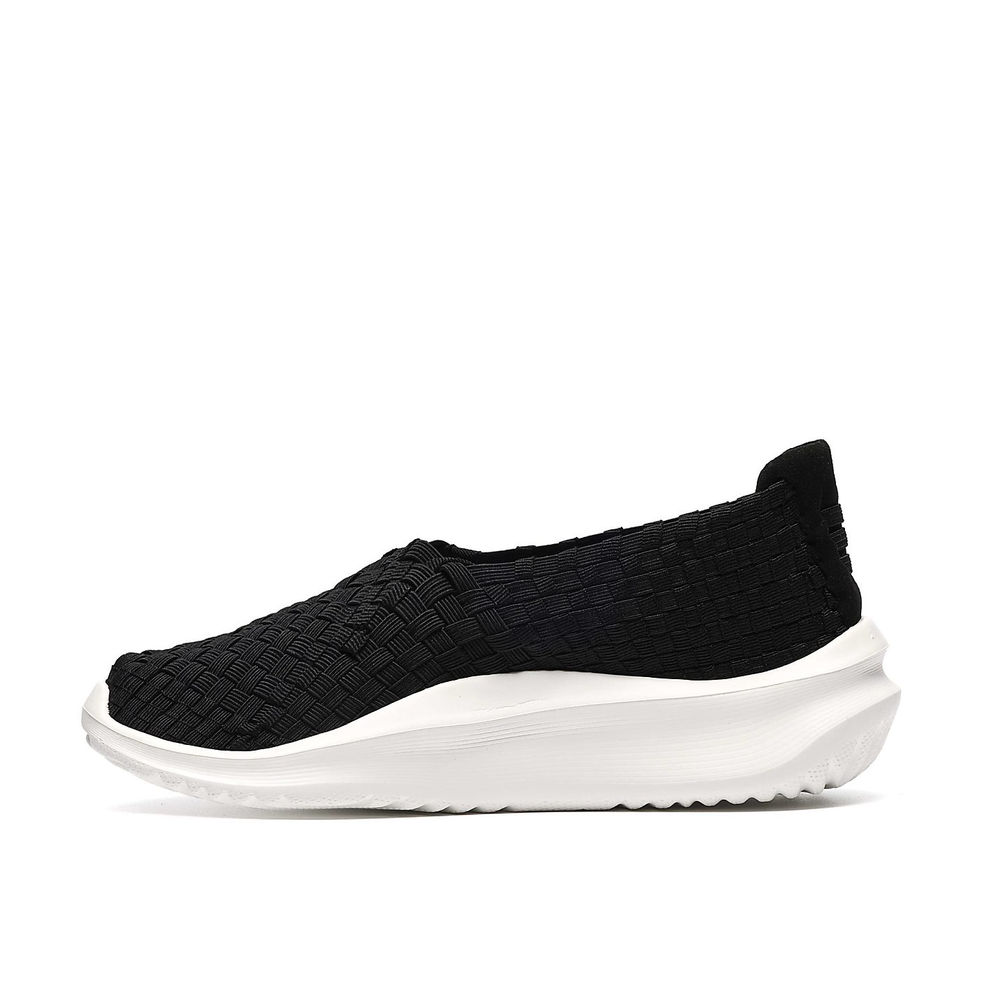 A black woven slip-on shoe with a thick white sole is centered against a plain white background. Product Image 3