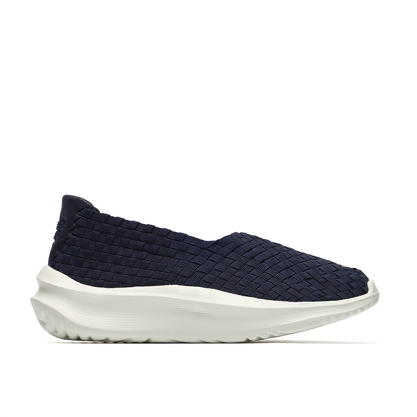 A navy blue woven slip-on shoe with a thick white sole sits against a plain white background. Product Image 1