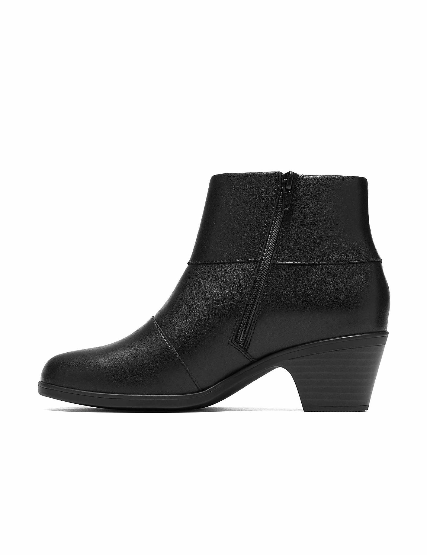 A black leather ankle boot with a low heel stands against a plain white background. Product Image 3