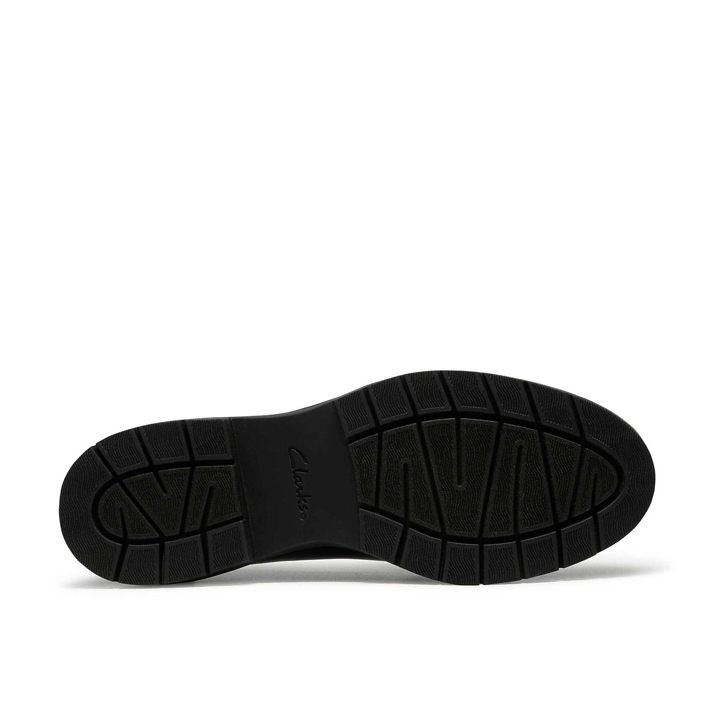 A black textured shoe sole is centered against a plain white background. Product Image 4