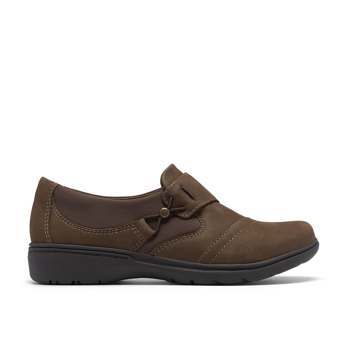 A brown leather slip-on shoe sits in the foreground against a plain white background. Product Image 1