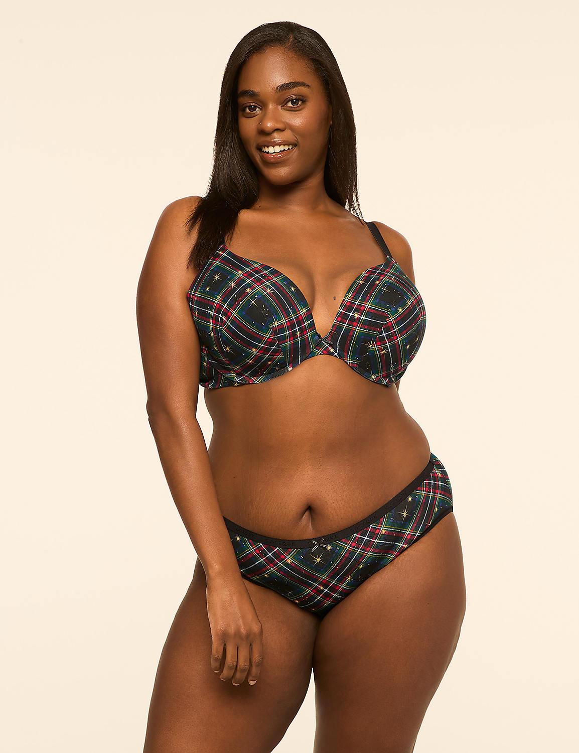 A smiling woman in a plaid bra and underwear stands against a plain, light-colored background. Product Image 4