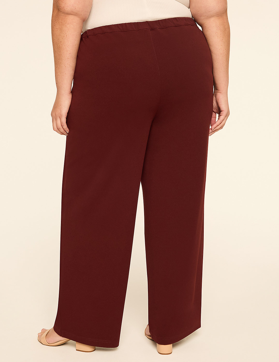 A person wearing brown wide-leg pants and black heels stands against a plain, light-colored background. Product Image 2